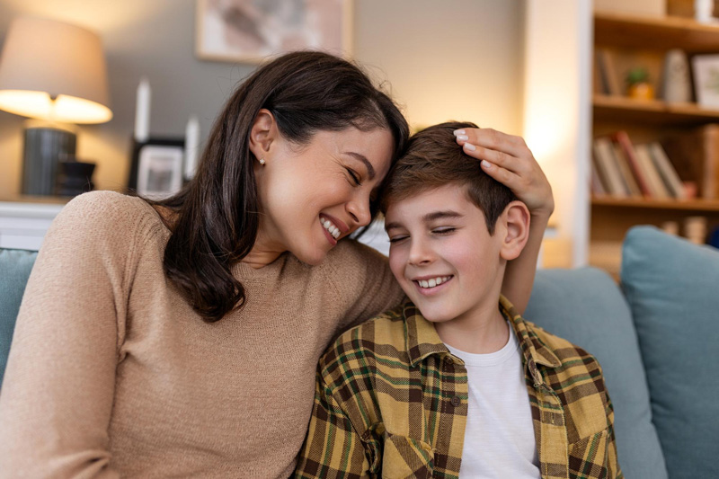 A mother comforts her teen and addresses the benefits of Therapy for Teens in Arlington, MA.