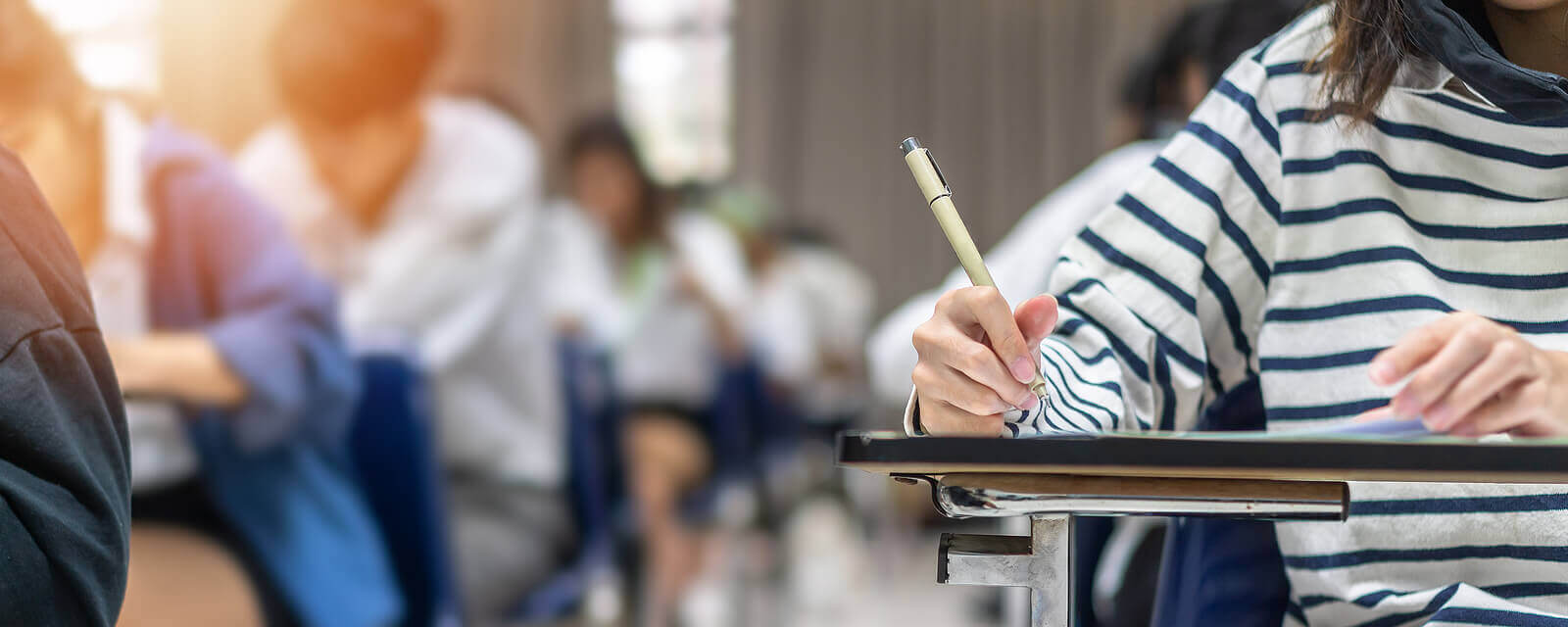 A young teen doing schoolwork at their desk. Do you think therapy for teens in Arlington, MA could be right for your teen? Speak with a teen therapist who understands teens with adhd in Arlington, MA. 