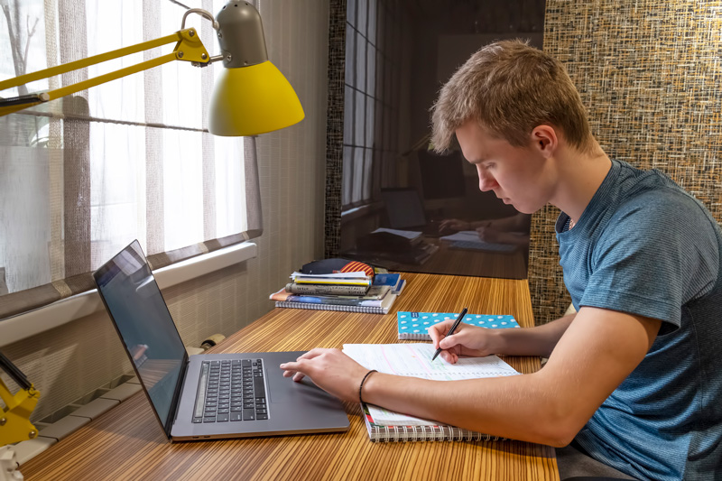 A young teen doing schoolwork at their desk. Do you think therapy for teens in Arlington, MA could be right for your teen? Speak with a teen therapist who understands teens with adhd in Arlington, MA.