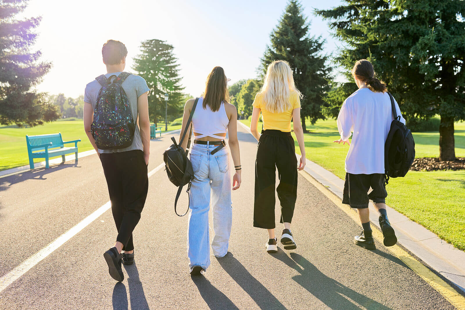 A group of teenagers walk outside together. Do you see your teens with OCD in Arlington, MA struggling? Therapy for Teens with a teen therapist could help them!
